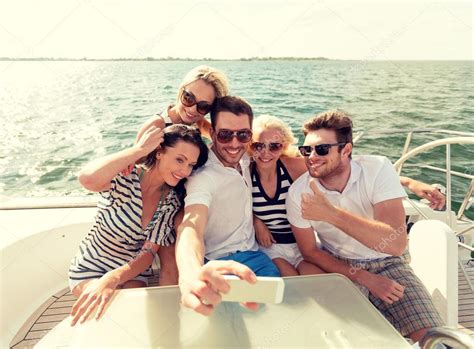 Smiling Friends Sitting On Yacht Deck — Stock Photo © Sydaproductions