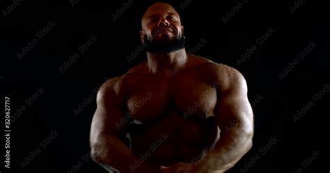 Bearded Bald Brutal Bearded Male Bodybuilder With A Naked Inflated Torso He Is In The Studio On