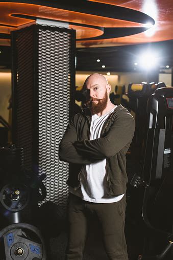 Portrait Of Wise Bodybuilding And Fitness Trainer In Gym Stock Photo