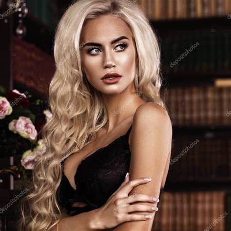 Beautiful Sexy Long Haired Blond Woman In Black Lingerie Posing In The