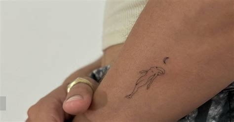 Single Needle Nude Woman Tattoo Located On The Forearm