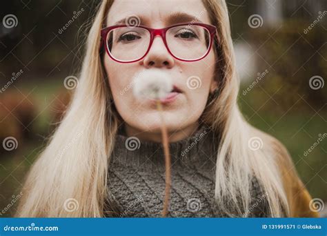 Slender Blonde With Long Hair Blowing On Dandelion Stock Image Image Of Autumn Botany