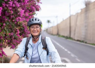 Attractive Smiling Senior Cyclist Woman On Stock Photo 2143545965 ...