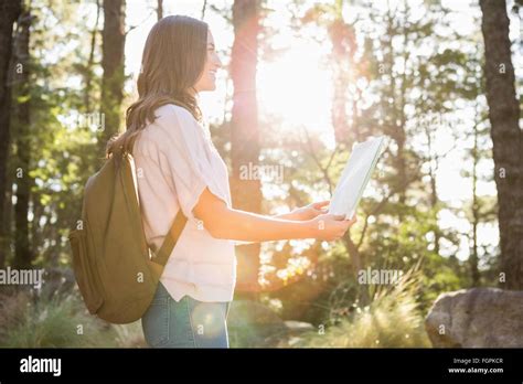 Pretty Brunette Hiker Reading Map Stock Photo Alamy