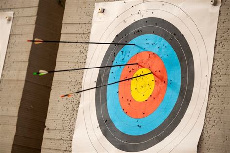 Premium Photo View Of An Archery Target With Several Arrows Stuck Into It