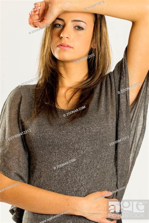 Gorgeous Long Haired Brunette Model Posing Against A White Background Stock Photo Picture And