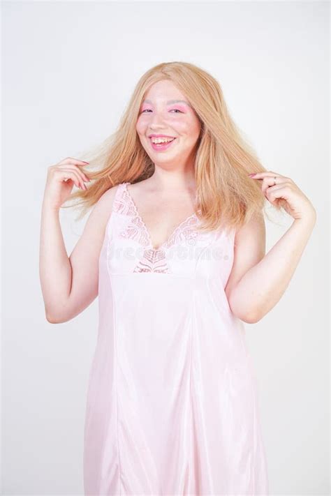 Charming Plus Size Blonde Asian Girl In Pink Pretty Silk Nightgown Standing And Happy Posing On