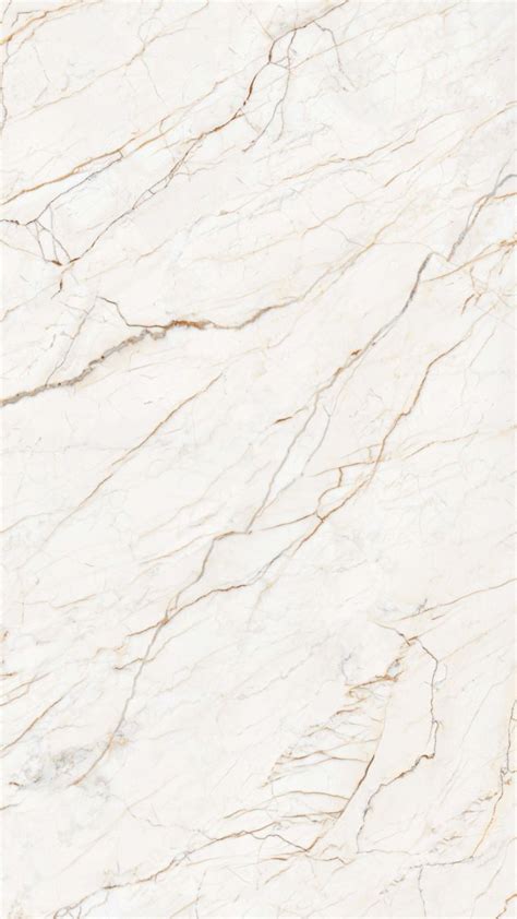 a white marble textured surface with some brown lines