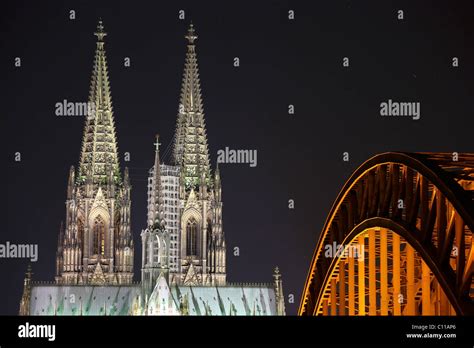 Cologne Cathedral With Hohenzollernbruecke Bridge At Night Cologne