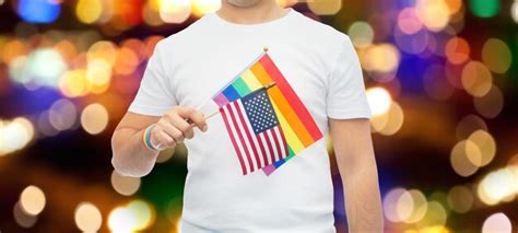 Premium Photo Man With Gay Pride Rainbow Flag And Wristband