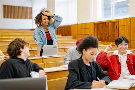 Group of multiethnic students with books and documents · Free Stock Photo