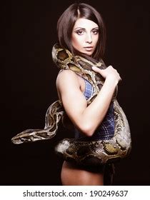 Sexy Brunette Holding Python Over Black Stock Photo 190249637 Shutterstock