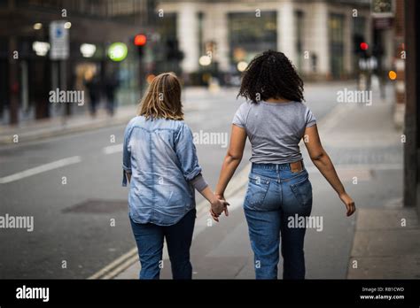 Lesbian Couple Walking Down The Street Stock Photo Alamy