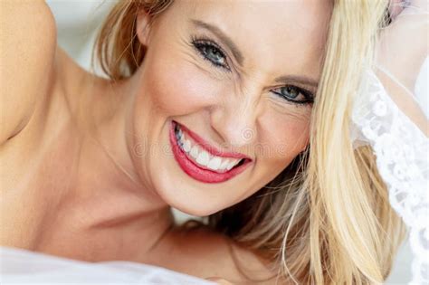 Timeless Allure Beautiful Blonde Strikes A Poised Pose Embodying Elegance And Grace In A