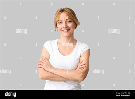 Beautiful Mature Woman On Light Background Stock Photo Alamy