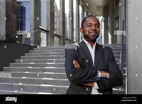 Portrait Of Successful African American Businessman Investor Mature Boss With Crossed Arms