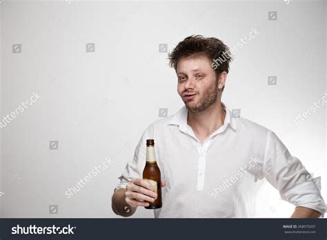 Man Drinking Beer With Funny And Weird Face Stock Photo 268075031