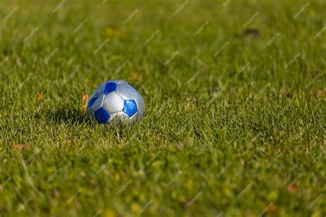 Premium Photo Soccer Ball On The Green Grass