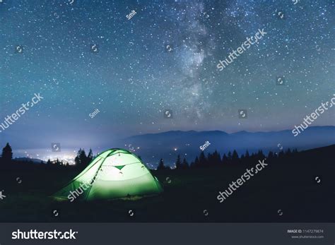 green tent lighted   flashlight stock photo