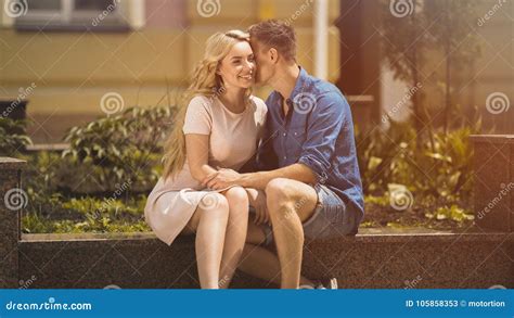 Handsome Man Whispering Tender Love Words In Beautiful Blonde Girls Ear Date Stock Image