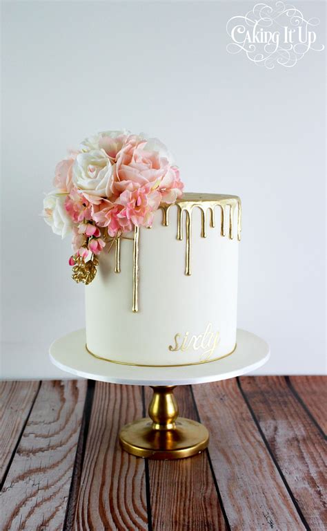 Classy And Elegant Golden Drizzle 60th Birthday Cake With A Pretty Posy