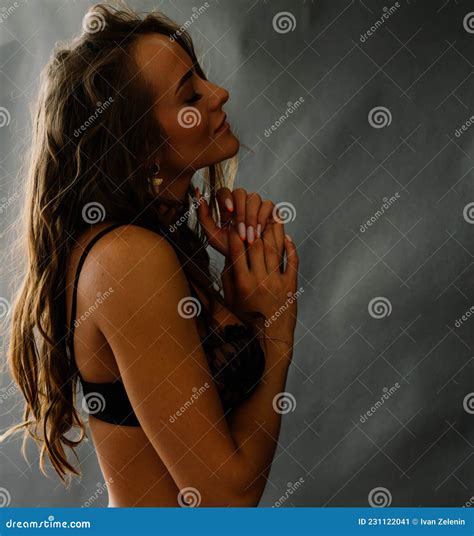 Seductive Pose Of Dark Haired Woman Wearing A Black Bikini Stock Image Image Of Long