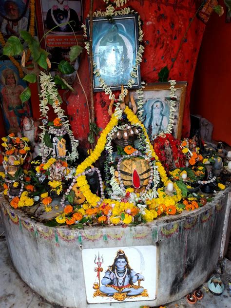 Hindu Altar Decorated with Flowers and Images of Deities · Free Stock Photo