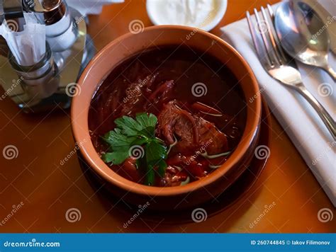 Belarusian Beet Borscht With Cabbage Garnished With Greens Stock Image