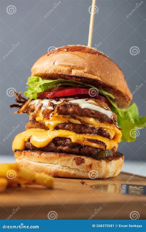 Loaded Cheeseburgers Three Triple Stacked Patties Stacked High With