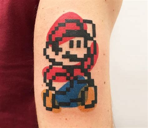 Pixelated Mario Bros Tattoo On The Back Of The Right Artofit