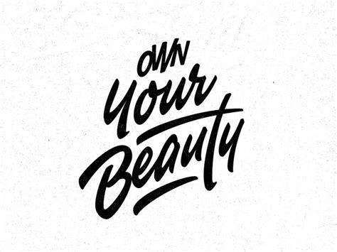 The Words Own Your Beauty Written In Black Ink