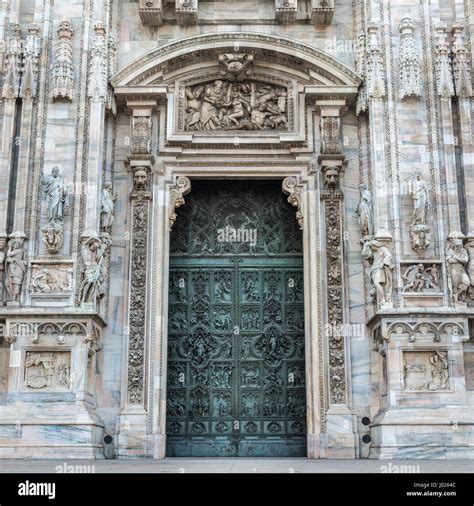 Duomo Of Milan Italy Detail Of Facade And Main Entrance Door To The