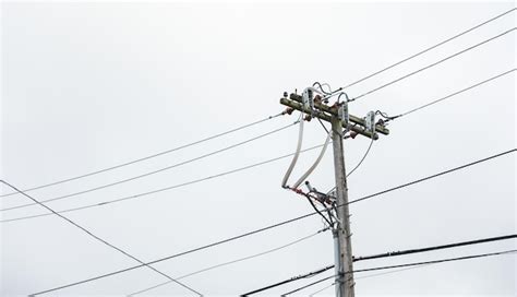 Premium Photo A Power Pole With Wires And Wires Attached To It