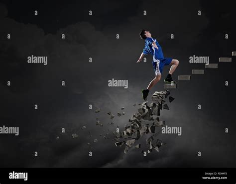 Sports Active Man Running On Stone Collapsing Ladder Stock Photo Alamy