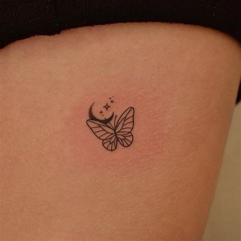 simple butterfly  moon tattoo located   rib