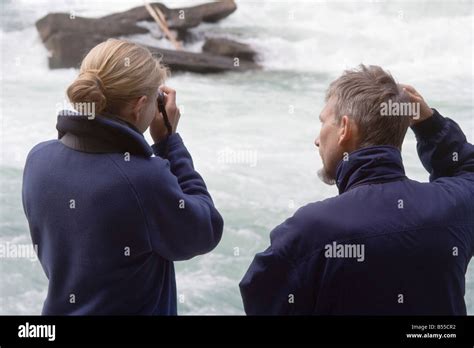 Father and daughter watching salmon run in Fraser River Rearguard Falls ...