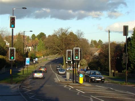 Cars Are Stopped At An Intersection With Traffic Lights