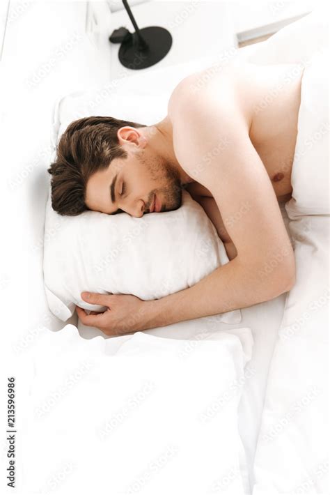Naked Man Sleeping In Bed Indoors At Home Stock Photo Adobe Stock