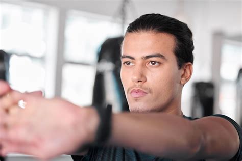 Premium Photo | Hands stretching fingers and man in gym ready to start ...