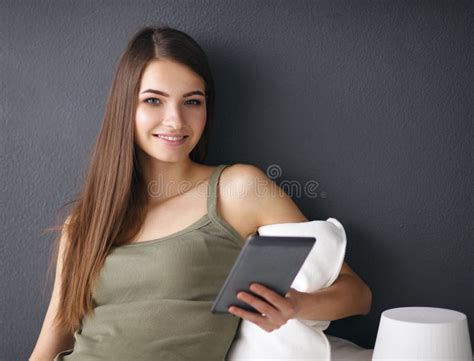 Pretty Brunette Woman Sitting On The Floor With A Stock Photo Image Of Light Planetable