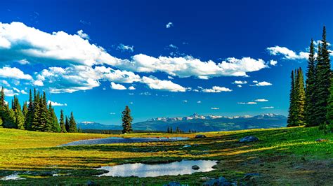 landscape mountains trees meadow water grass clouds blue sky  hd