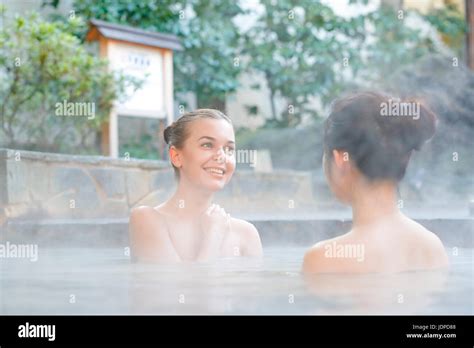Caucasian Woman With Japanese Friend Bathing At Traditional Hot Spring Tokyo Japan Stock Photo