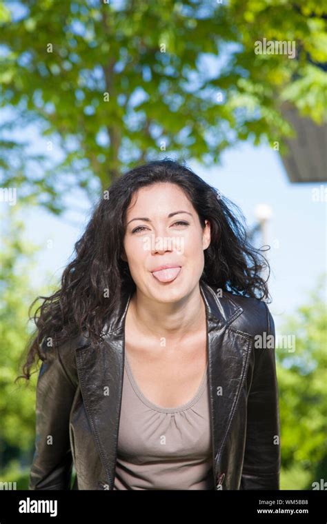 Brunette Woman Teasing At Exterior Background Stock Photo Alamy