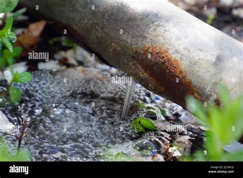 Water leak or breakthrough rusty pipe Stock Photo - Alamy