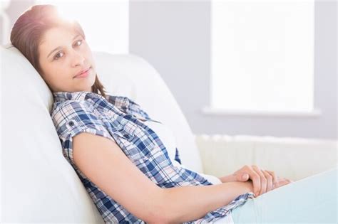 Premium Photo Pretty Brunette Relaxing On The Couch