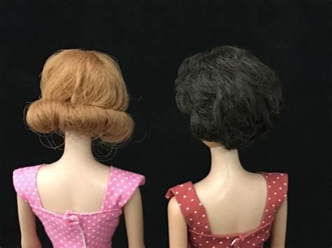 Lot 2 VINTAGE DOLLS INCLUDING BRUNETTE BUBBLE CUT BARBIE WEARING ON THE GO SHEATH AND