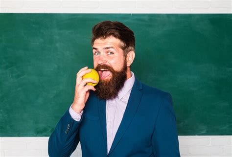 Premium Photo Portrait Of A Funny Teacher Or Professor Near Blackboard Thinking Serious Mature
