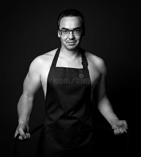 Naked Man In Apron Cooking Dessert On The Kitchen Stock Photo Image