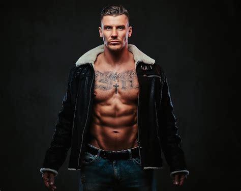 Premium Photo A Macho Stylish Man In Jeans Jacket With Naked Torso And Stylish Hair Over Dark