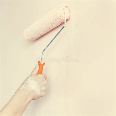 Woman Painting A Wall With A Roller Brush Stock Image Image Of